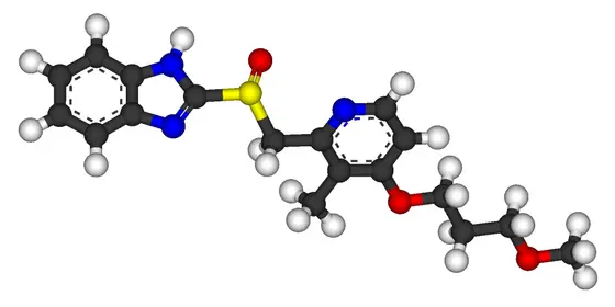 Das Bild zeigt das 3D-Modell des Moleküls Rabeprazol, einem Medikament zur Behandlung von Magenbeschwerden. Es sind verschiedene Atome in unterschiedlichen Farben dargestellt, wobei die Struktur des Moleküls klar erkennbar ist.