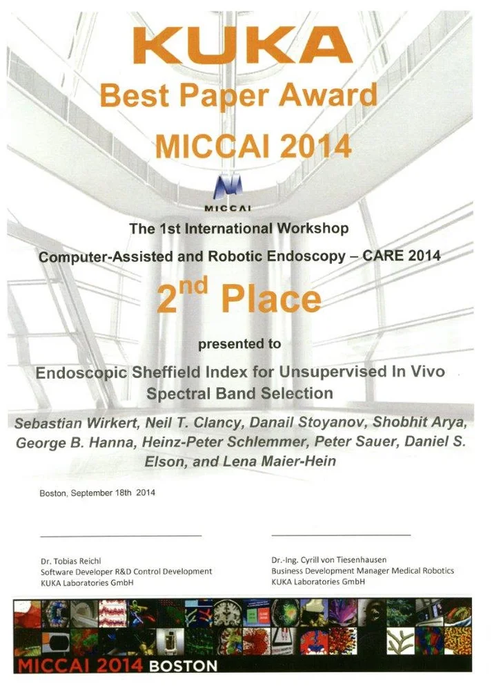 Certificate for the KUKA Best Paper Award at MICCAI 2014, recognizing the research titled "Endoscopic Sheffield Index for Unsupervised In Vivo Spectral Band Selection." It lists the authors and includes the event details and date of presentation, September 18, 2014, in Boston.