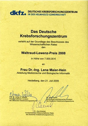 A certificate from the German Cancer Research Center awards the Waltraud-Lewenz Prize 2008 for €7,500 to Dr.-Ing. Lena Maier-Hein. Dated July 21, 2009, it signifies recognition based on the council's decision, emphasizing contributions in medical and biological informatics.