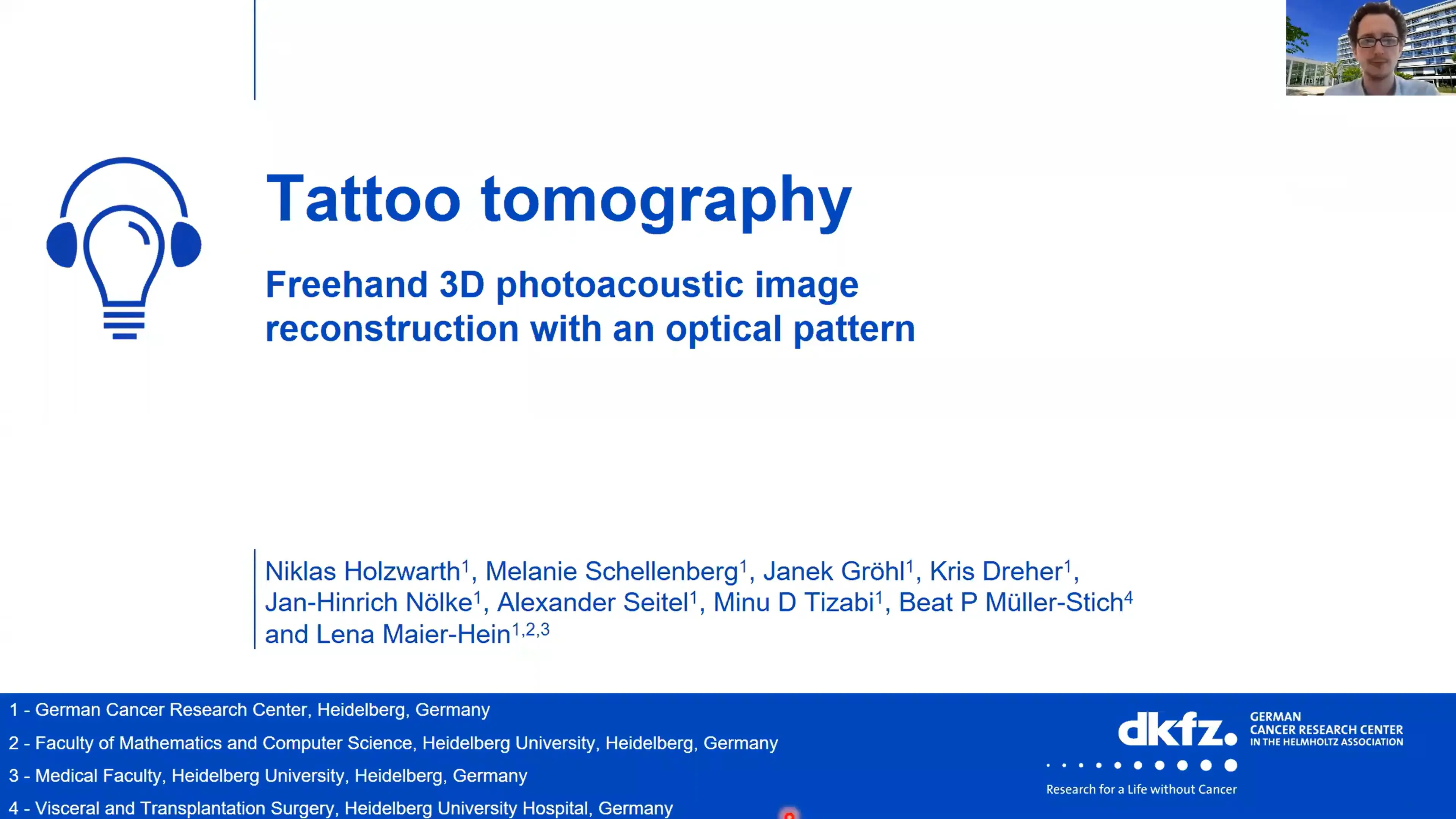 Title slide for a presentation on "Tattoo Tomography," discussing freehand 3D photoacoustic image reconstruction using an optical pattern. It includes the names of the authors and their affiliations with various research institutions in Heidelberg, Germany. A presenter can be seen in a video call.