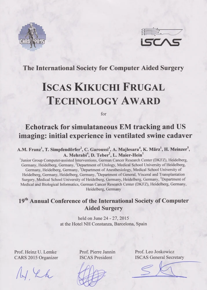 A certificate awarding the ISCAS Kikuchi Frugal Technology Award for research on simultaneous electromagnetic tracking and ultrasound imaging in ventilated swine cadavers. The certificate includes the names of researchers, event details, and is dated June 24-27, 2015, at the Hotel NH Constanza in Barcelona, Spain.