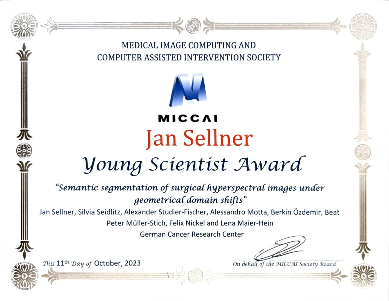 Certificate for the MICCAI Young Scientist Award presented to Jan Sellner for research on "Semantic segmentation of surgical hyperspectral images under geometrical domain shifts." The award acknowledges contributions from various collaborators associated with the German Cancer Research Center, dated October 11, 2023.