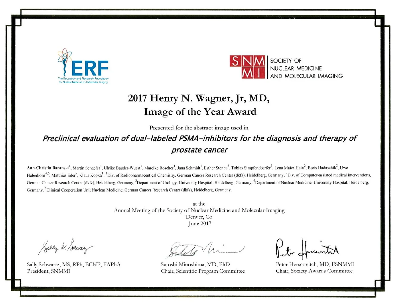 A certificate titled "2017 Henry N. Wagner, Jr., MD, Image of the Year Award" recognizing research on dual-labeled PSMA-inhibitors for prostate cancer diagnosis and therapy. It lists recipients and organizers, including names and titles, and notes the award was presented at a meeting in Denver, Colorado, in June 2017.