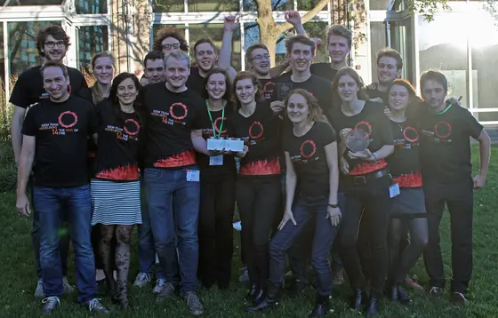 The Heidelberg team with the aluminum BioBrick trophy of the iGEM world champion. The team was supervised by Prof. Roland Eils and Dr. Barbara Di Ventura (front row, on the left).
