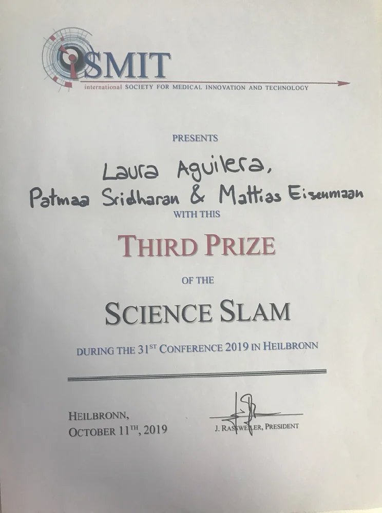 Certificate awarded to Laura Aguilera, Patmaa Sridharan, and Mattias Eisemann for winning Third Prize in the Science Slam at the 31st Conference of the International Society for Medical Innovation and Technology. The event took place in Heilbronn on October 11, 2019.