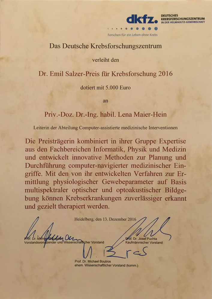 Certificate awarded by the German Cancer Research Center for the Dr. Emil Salzer Prize for Cancer Research 2016, featuring a monetary prize of 5,000 Euros. It recognizes Prof. Dr. Lena Maier-Hein for her contributions to computer-assisted medical interventions. Dated December 13, 2016.